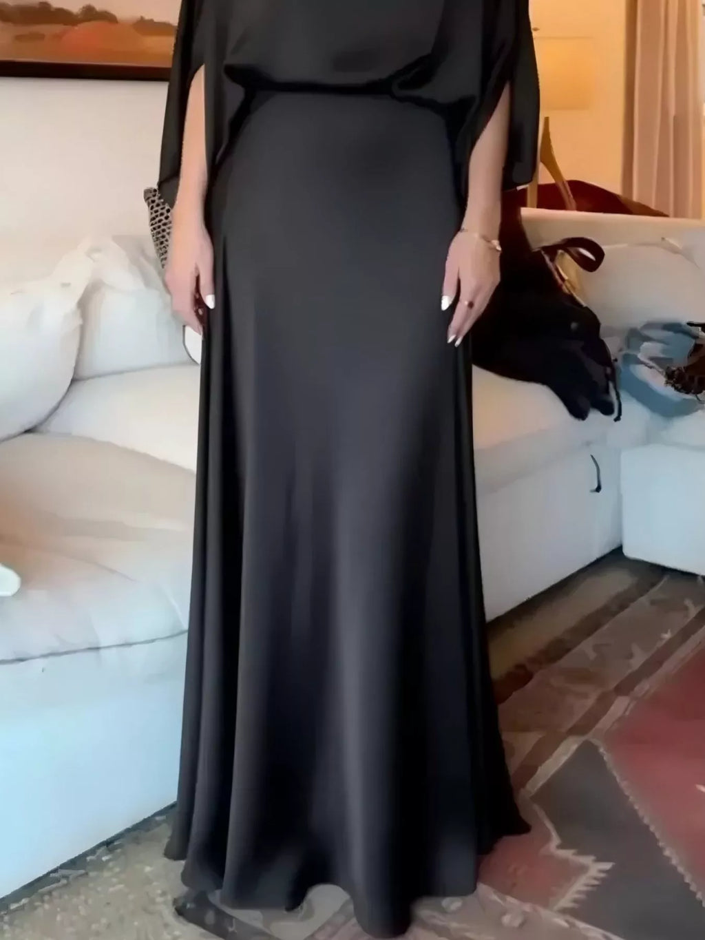 Black satin maxi dress with batwing sleeves and draped bodice front detail