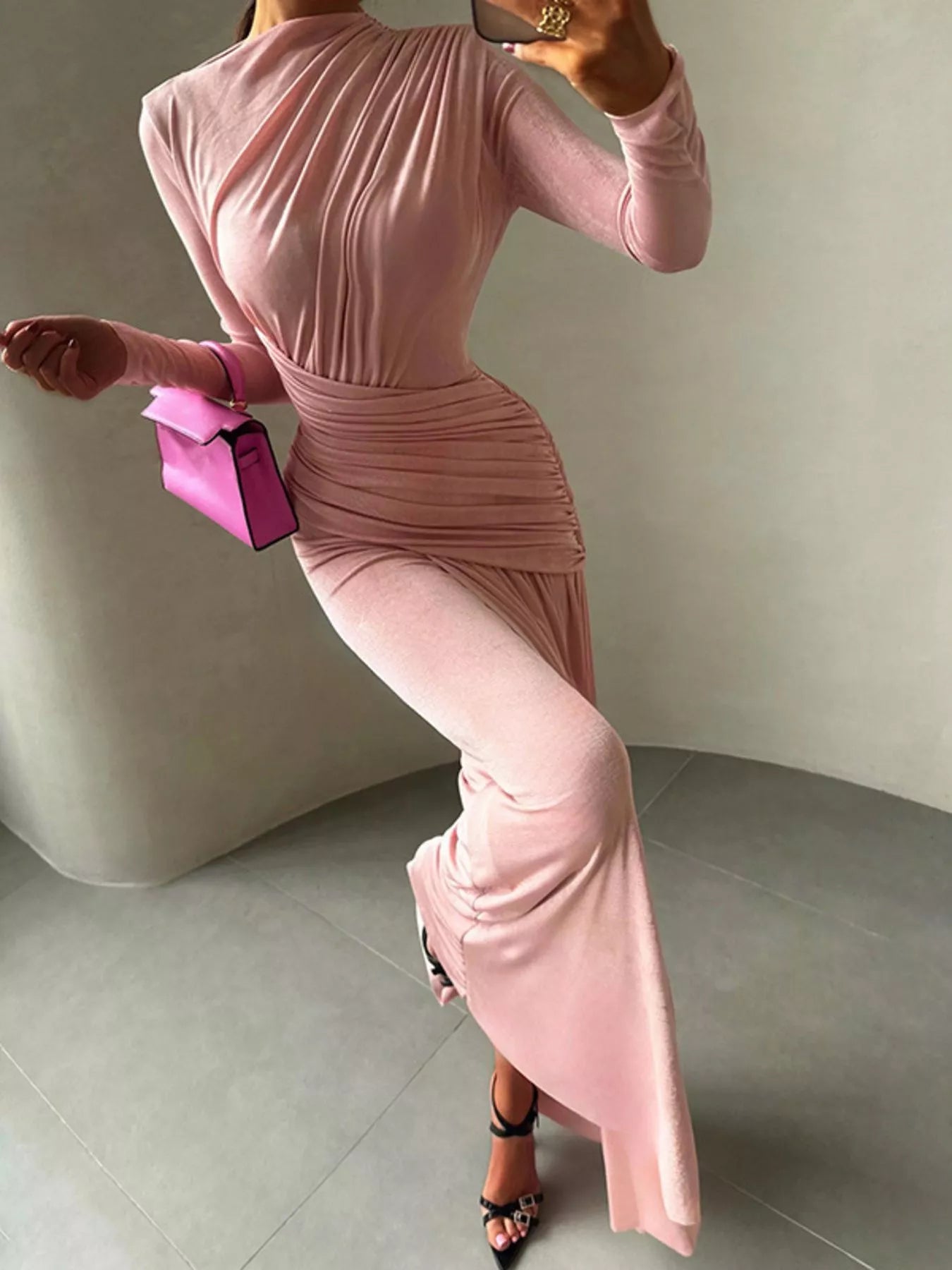 Pink long-sleeve maxi dress with ruched bodice, high neck, and side gathered detail