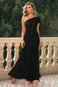 Black one-shoulder ruched maxi dress with draped bodice and tiered skirt