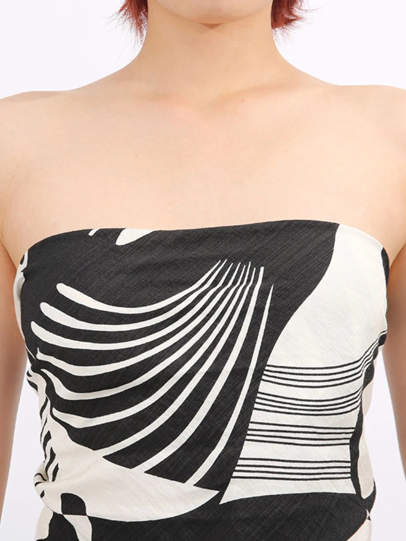 Women’s strapless tube top with black-and-white abstract swirl and stripe print