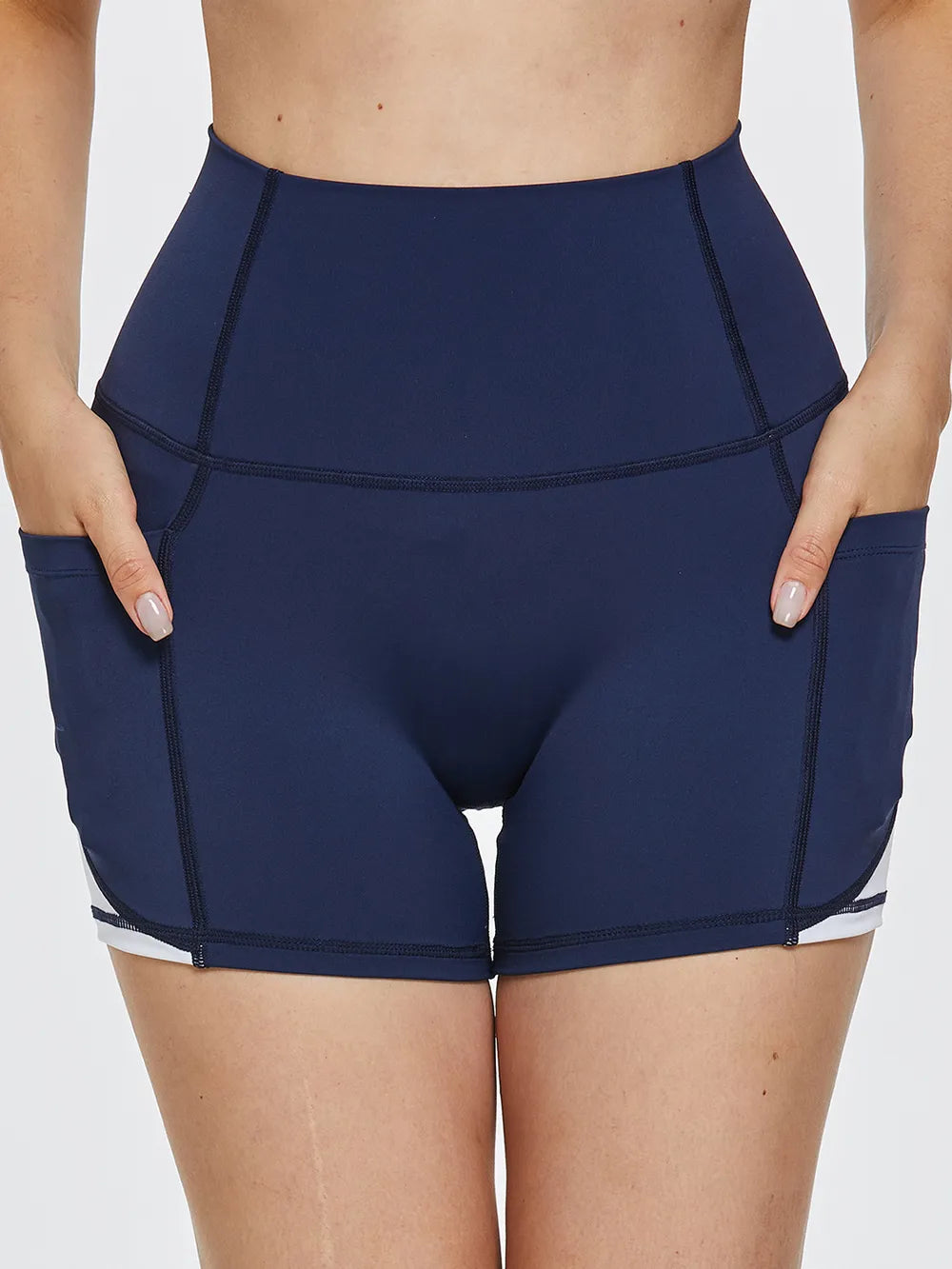 High-waist active shorts, navy, front view with contrast white side stripe