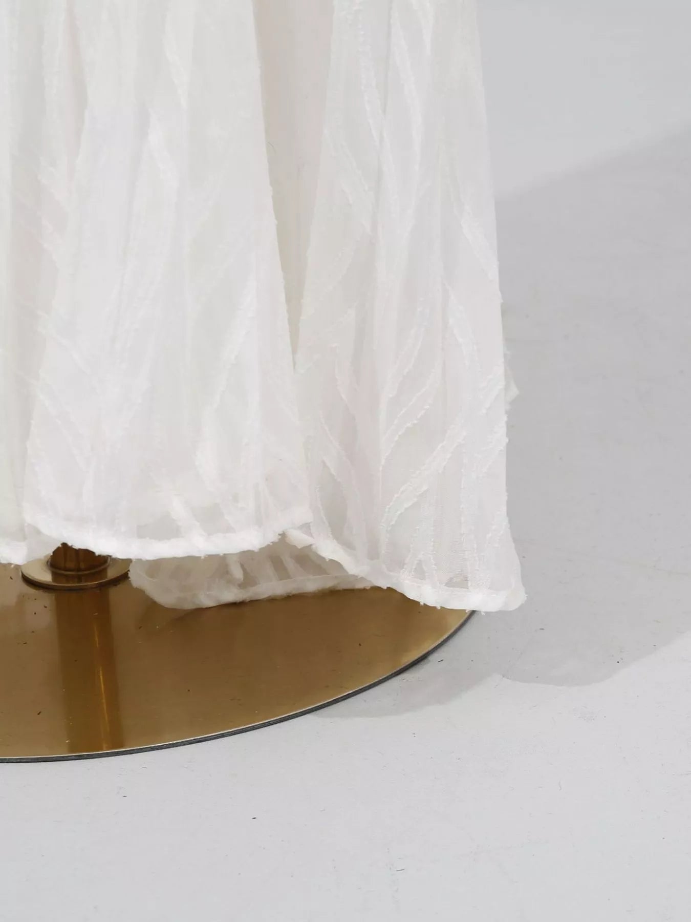 White long sleeve maxi dress with gathered skirt hem