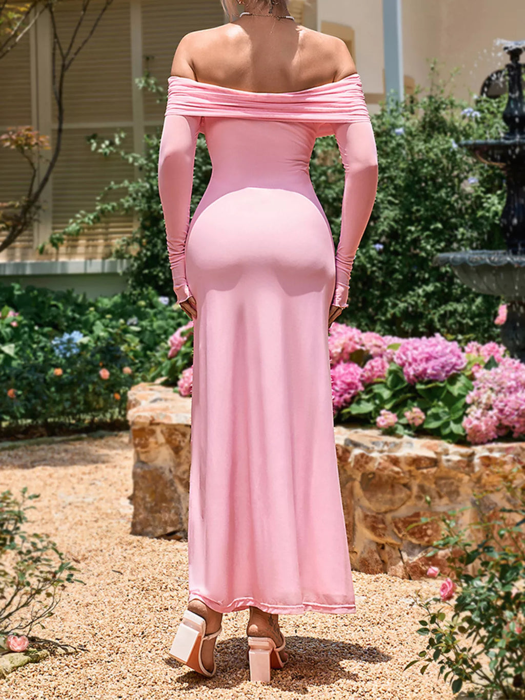 Pink off-shoulder ruched maxi dress with long sleeves and flowing ankle-length silhouette