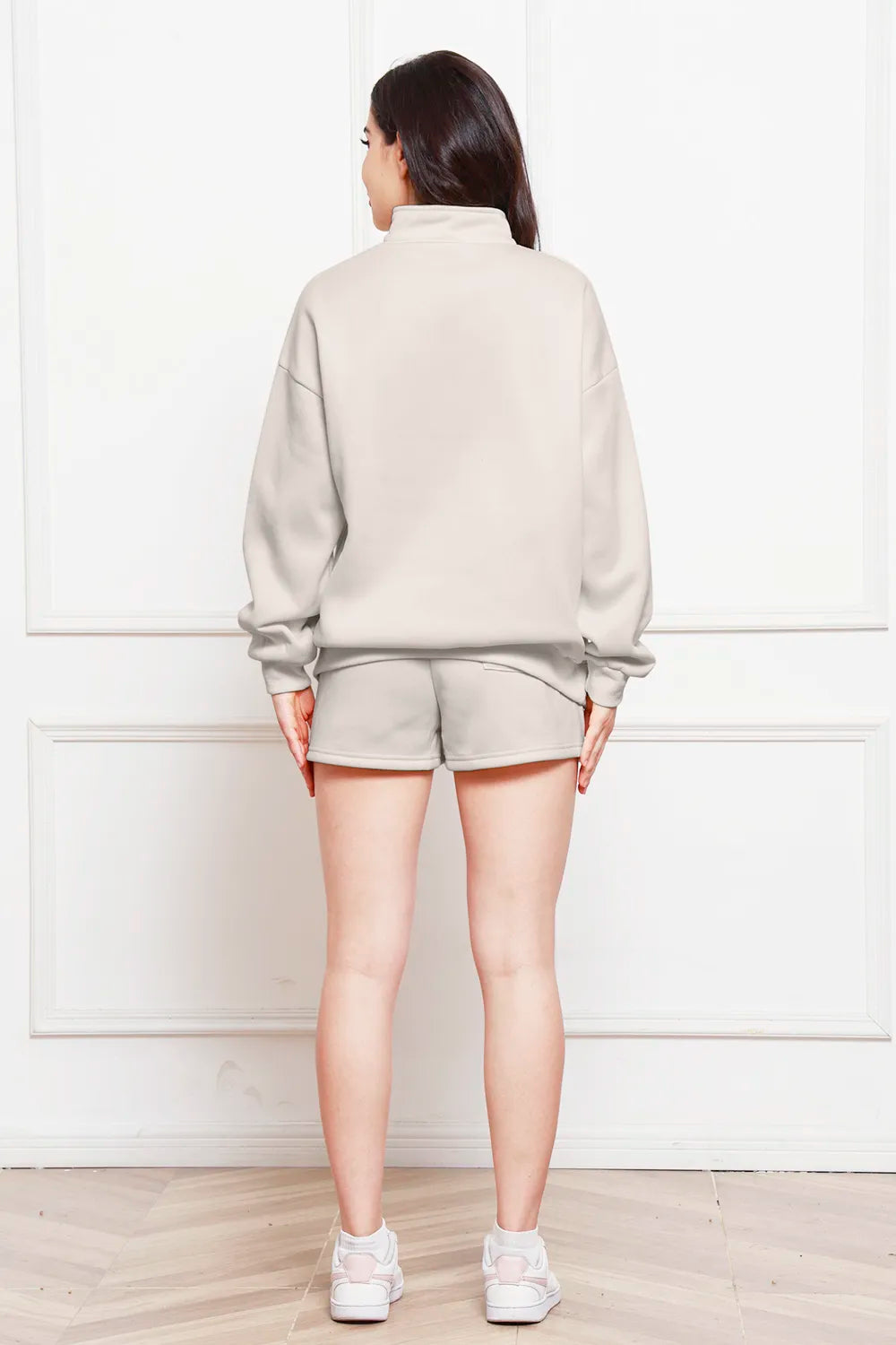 Ivory half-zip long sleeve sweatshirt and drawstring shorts set, back view