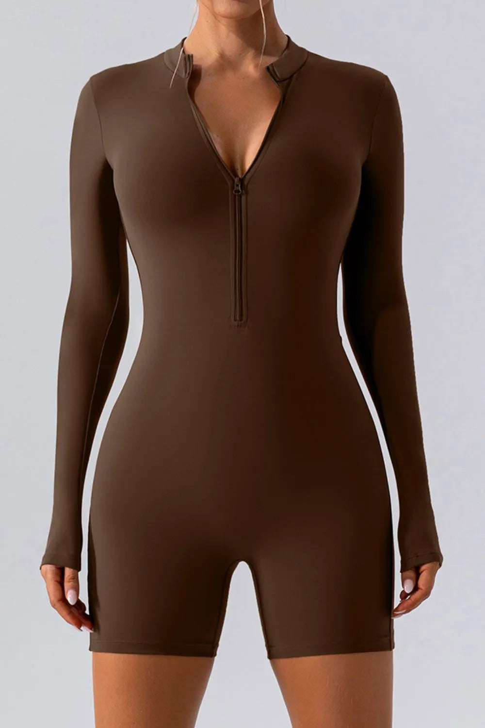 Chocolate half-zip long-sleeve active romper with front zipper and fitted romper