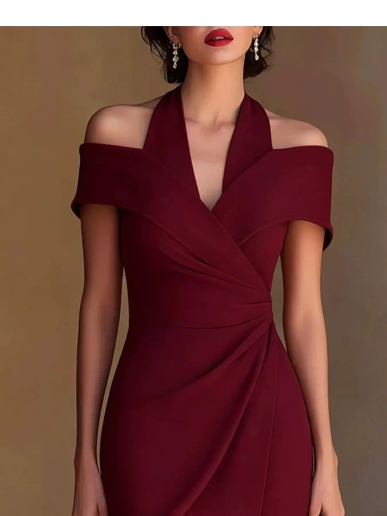 Burgundy cold-shoulder halter neck midi dress, V-neck front with wrap-style drape.