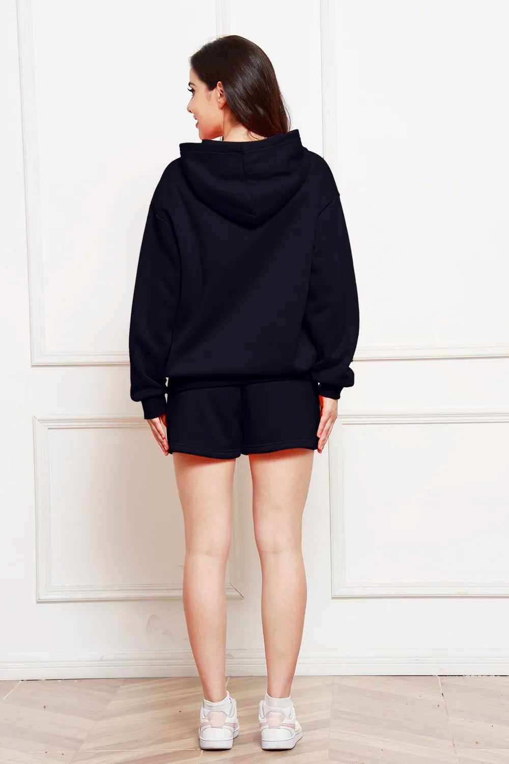 Dark navy hoodie and matching shorts set, drawstring hood, back view