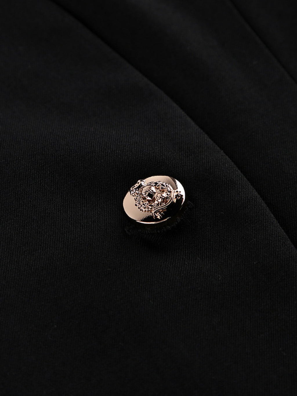 Black blazer dress with gold-tone decorative button at the center front