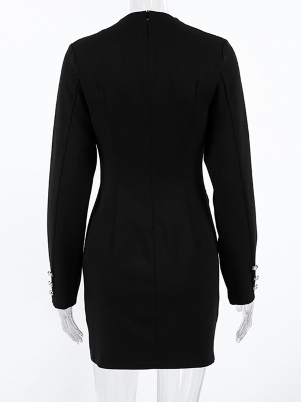 Back view of black long-sleeve mini dress with tailored seams and fitted silhouette.