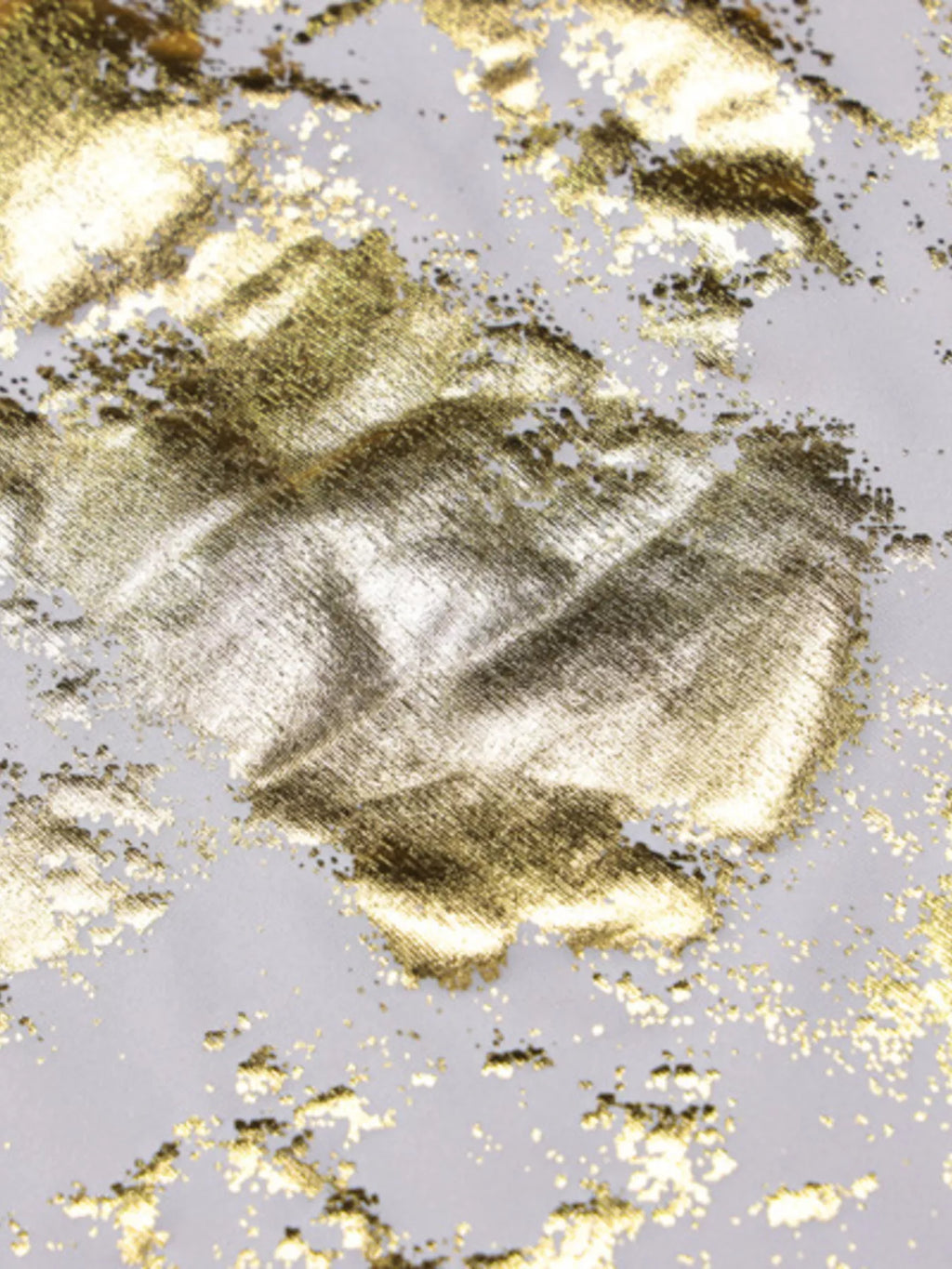 Gold sequin maxi dress fabric detail with scattered speckle pattern