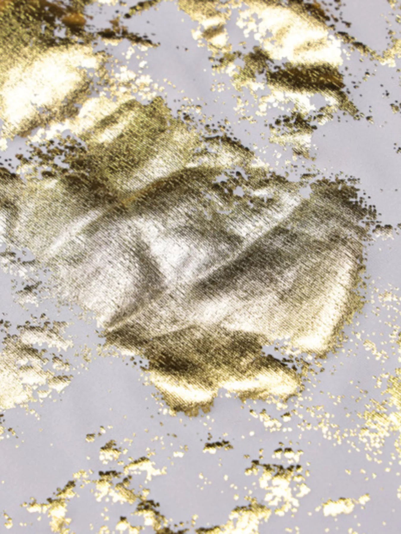 Gold sequin maxi dress fabric detail with scattered speckle pattern