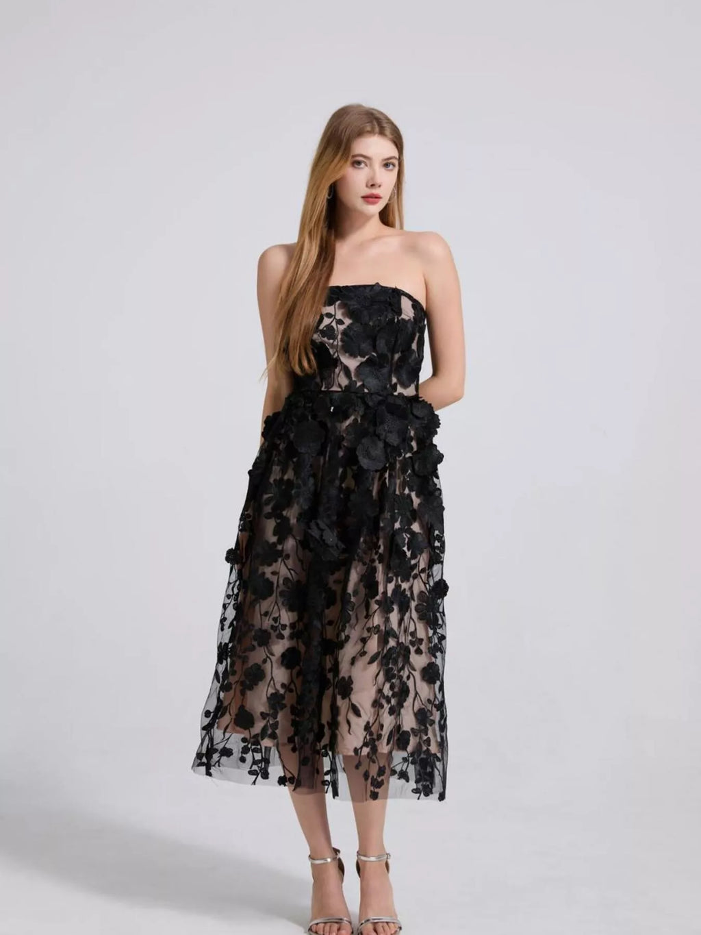 Black strapless midi dress with statement floral applique ruffles on sheer tulle
