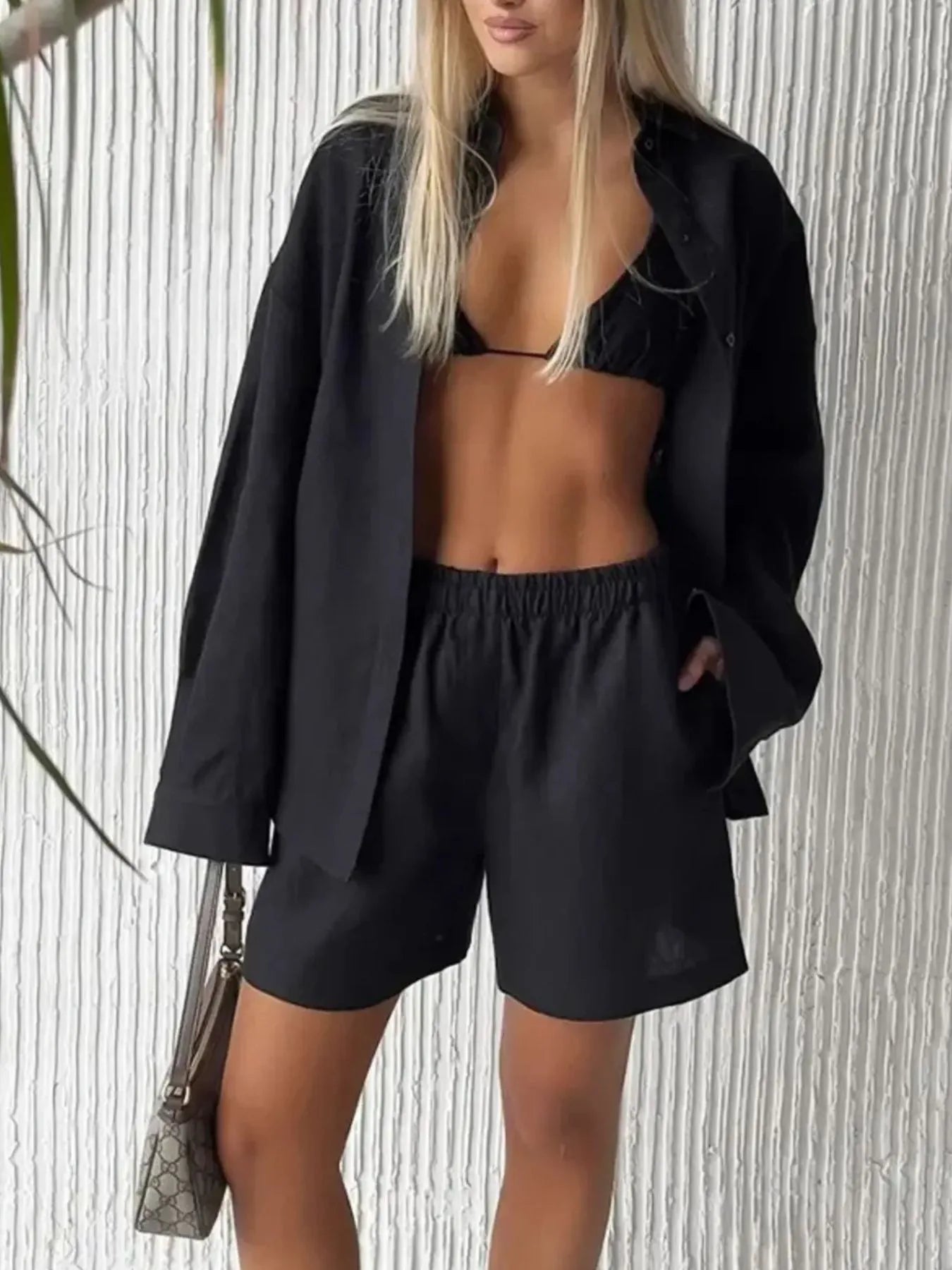 Black button-up long-sleeve shirt and matching elastic-waist shorts set, front view