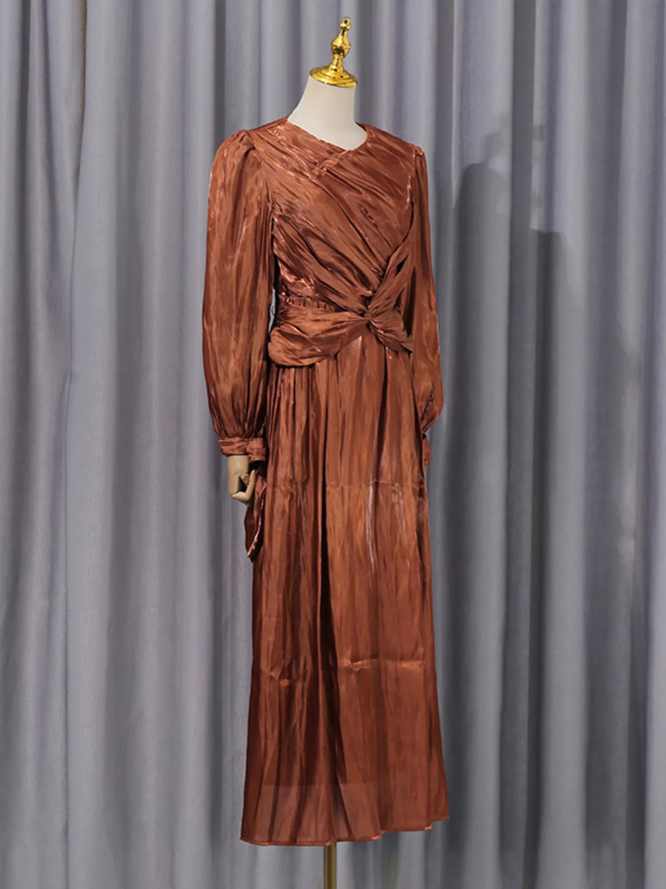 Coffee-brown twisted drape long-sleeve maxi dress on mannequin