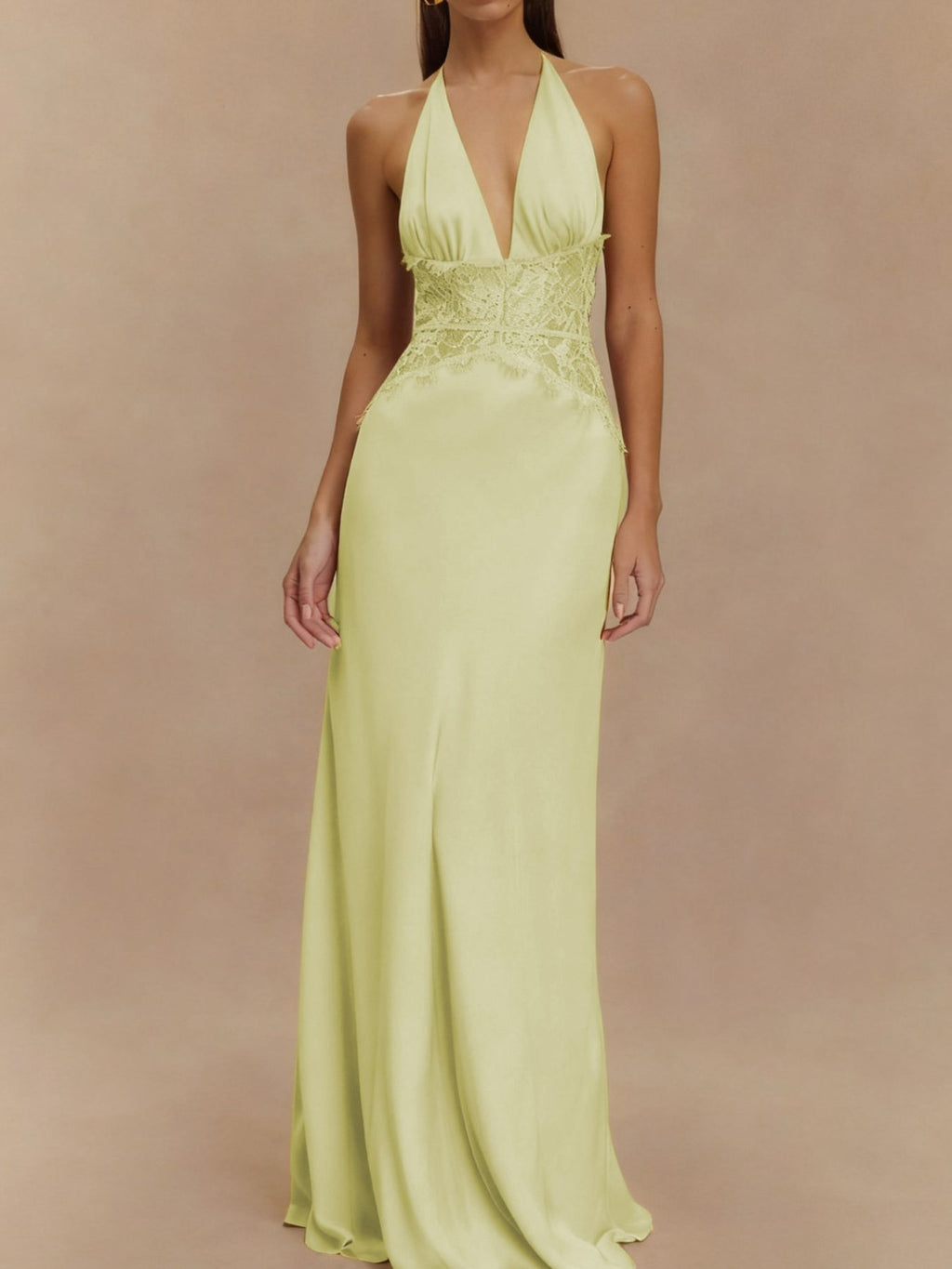 Light yellow halter maxi dress with lace-trim V neckline and fitted waist, full-length skirt