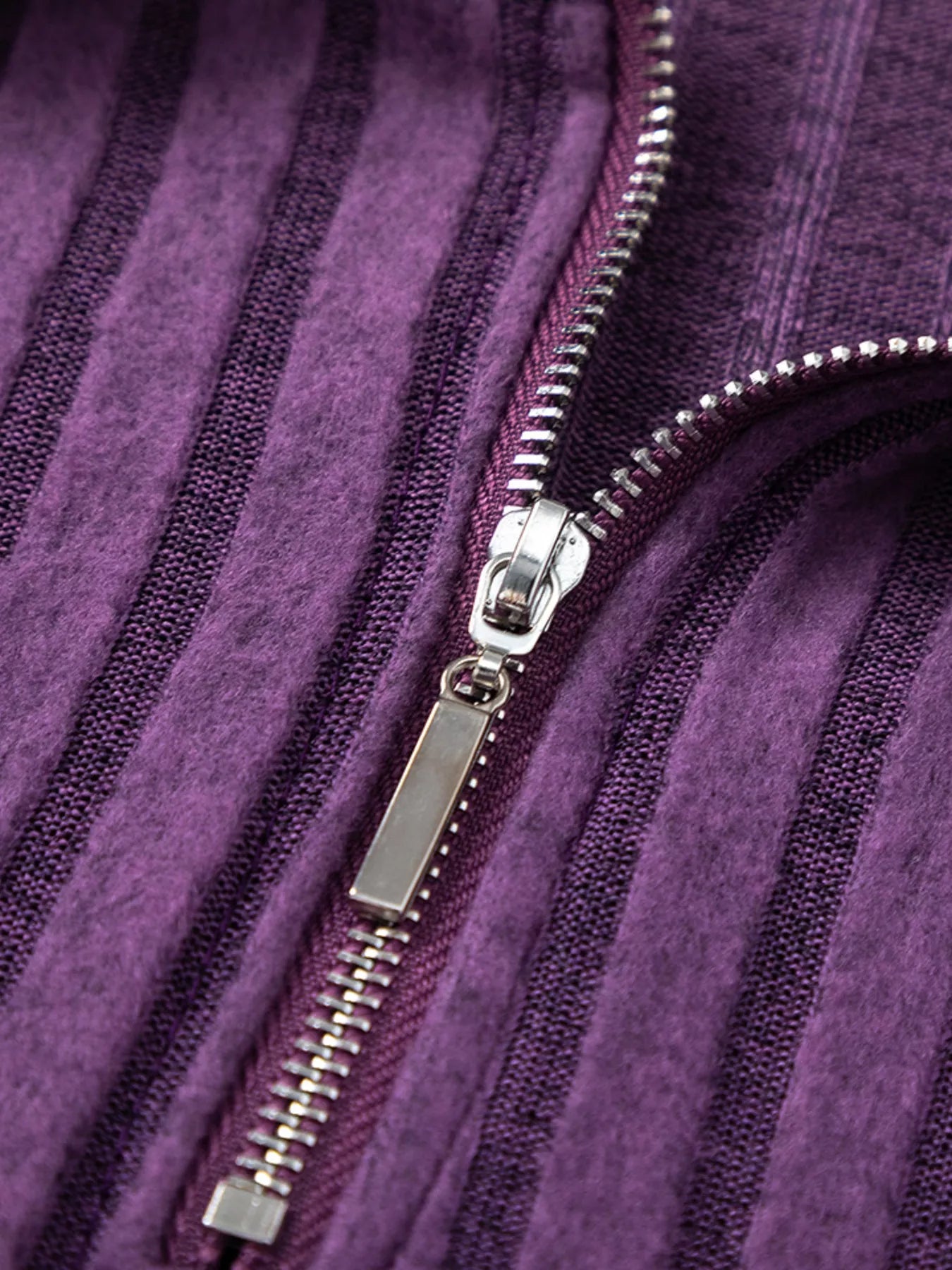 Purple ribbed knit top and pants set fabric, zipper tape close-up detail