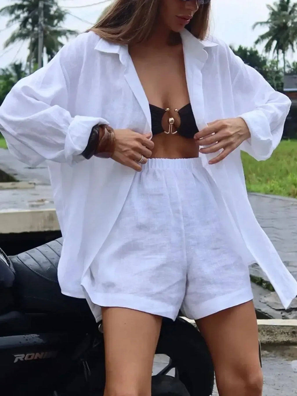 White button-up long-sleeve shirt and matching shorts set, open neckline