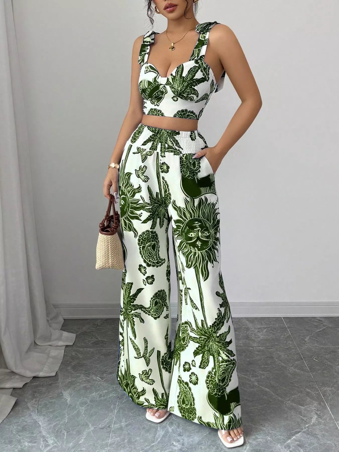 Green and white floral crop top and wide-leg pants set, sleeveless with tied waist