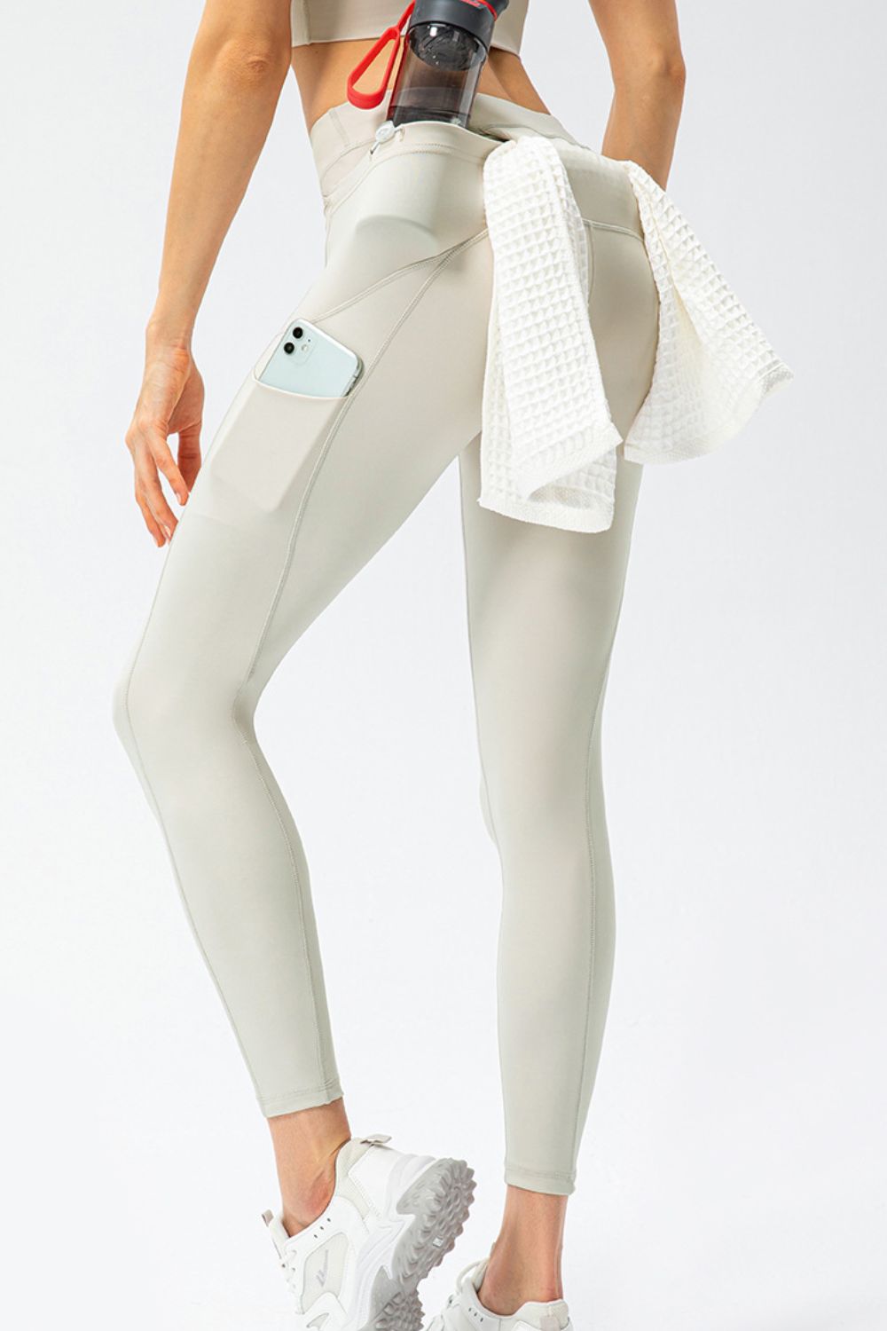 Cream slim fit high-waist long sports pants with side pocket and ankle cuffs