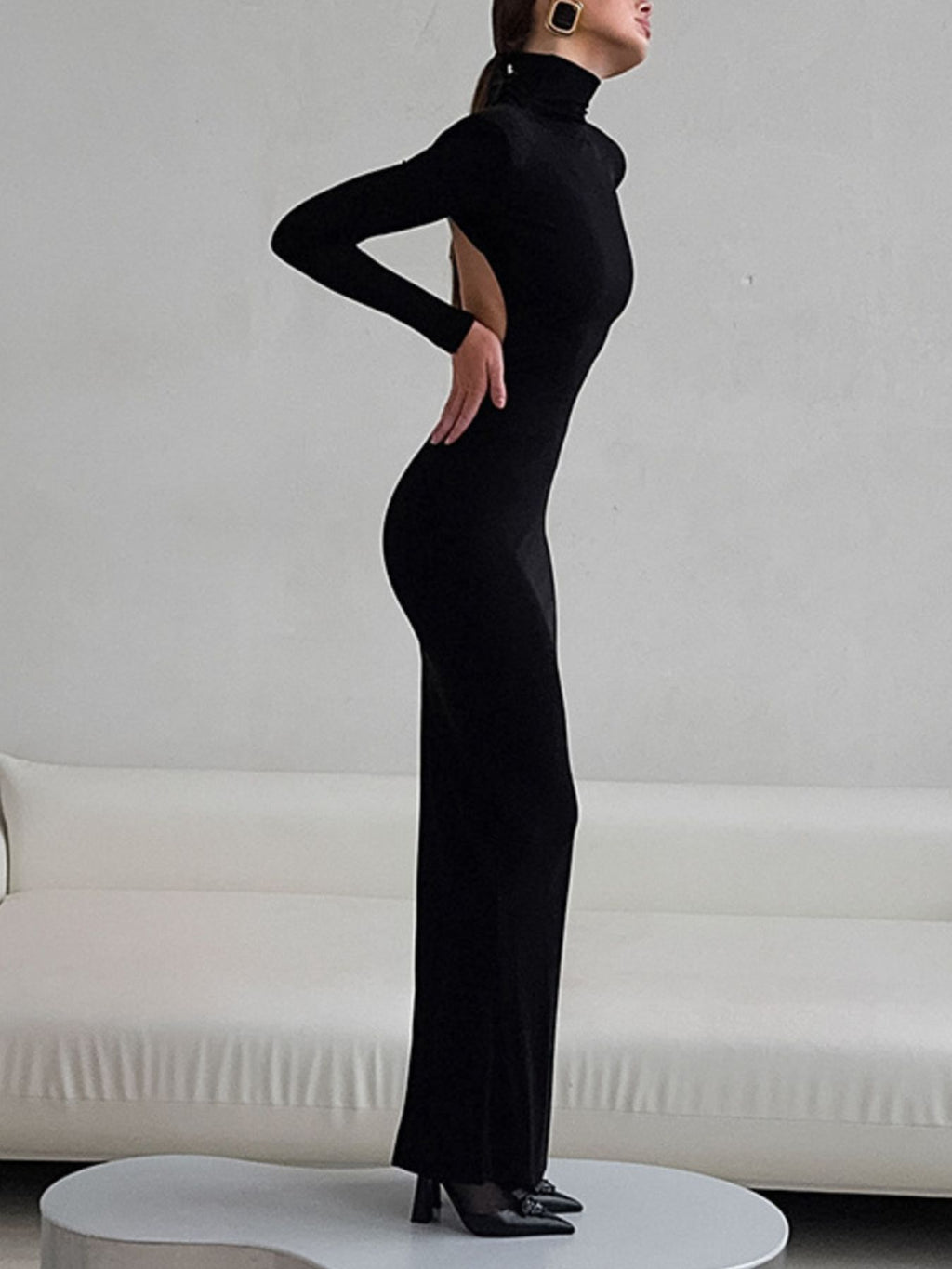 Black fitted turtleneck long-sleeve bodycon maxi dress with open-back cutout