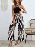 Black wide-strap sleeveless crop top with zigzag patterned wide-leg pants set