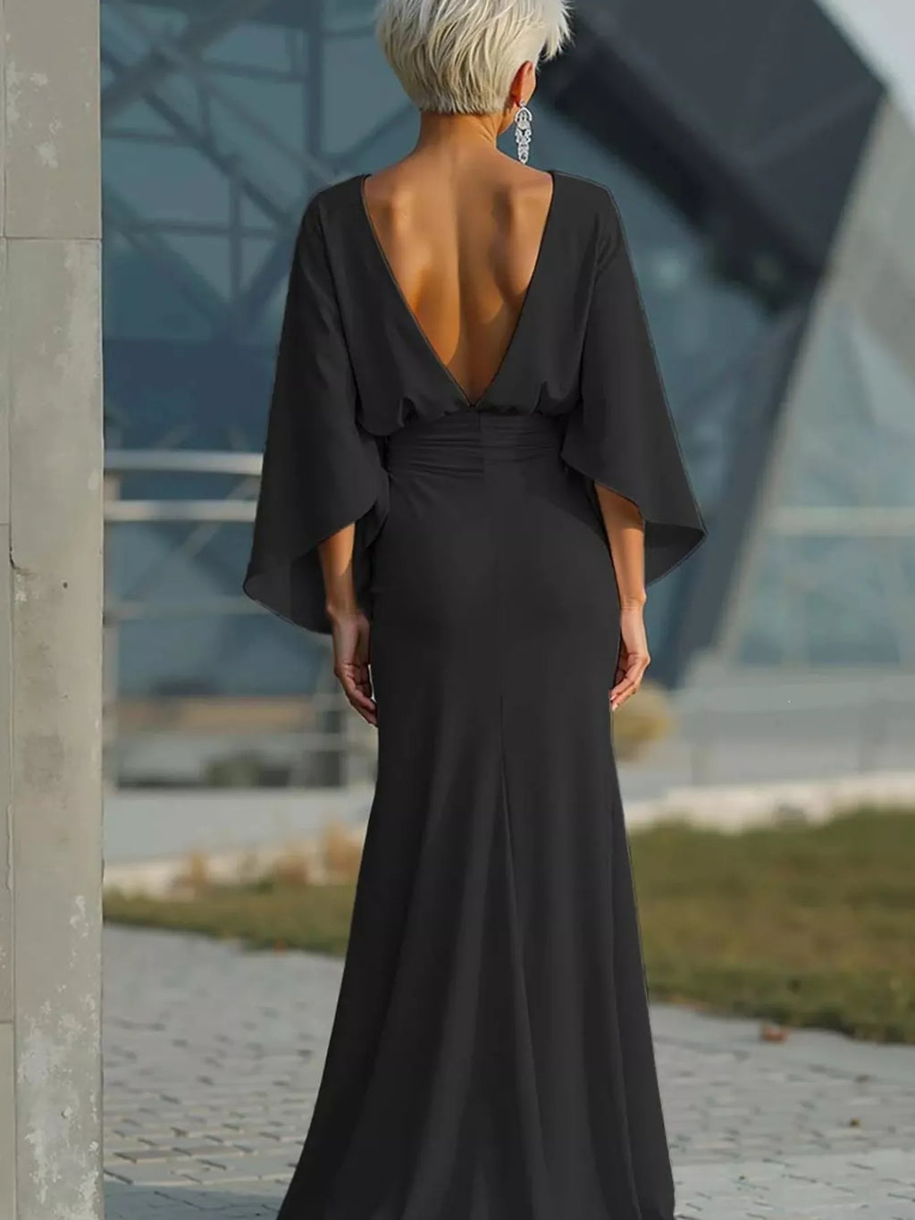 Black satin maxi dress with batwing sleeves and open V-back, ruched waist