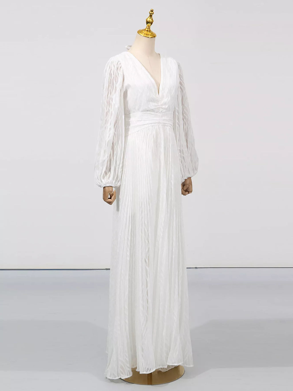 White v-neck maxi dress with long balloon sleeves and gathered skirt panels