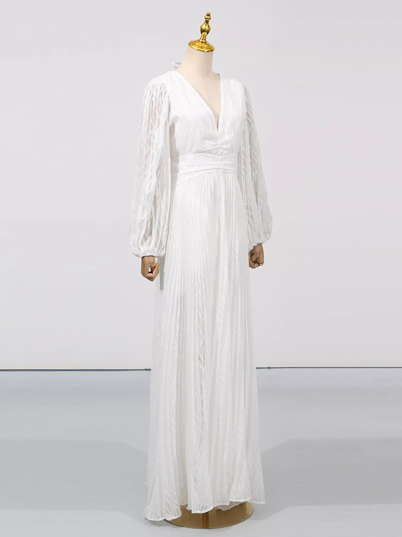 White v-neck maxi dress with long balloon sleeves and gathered skirt panels