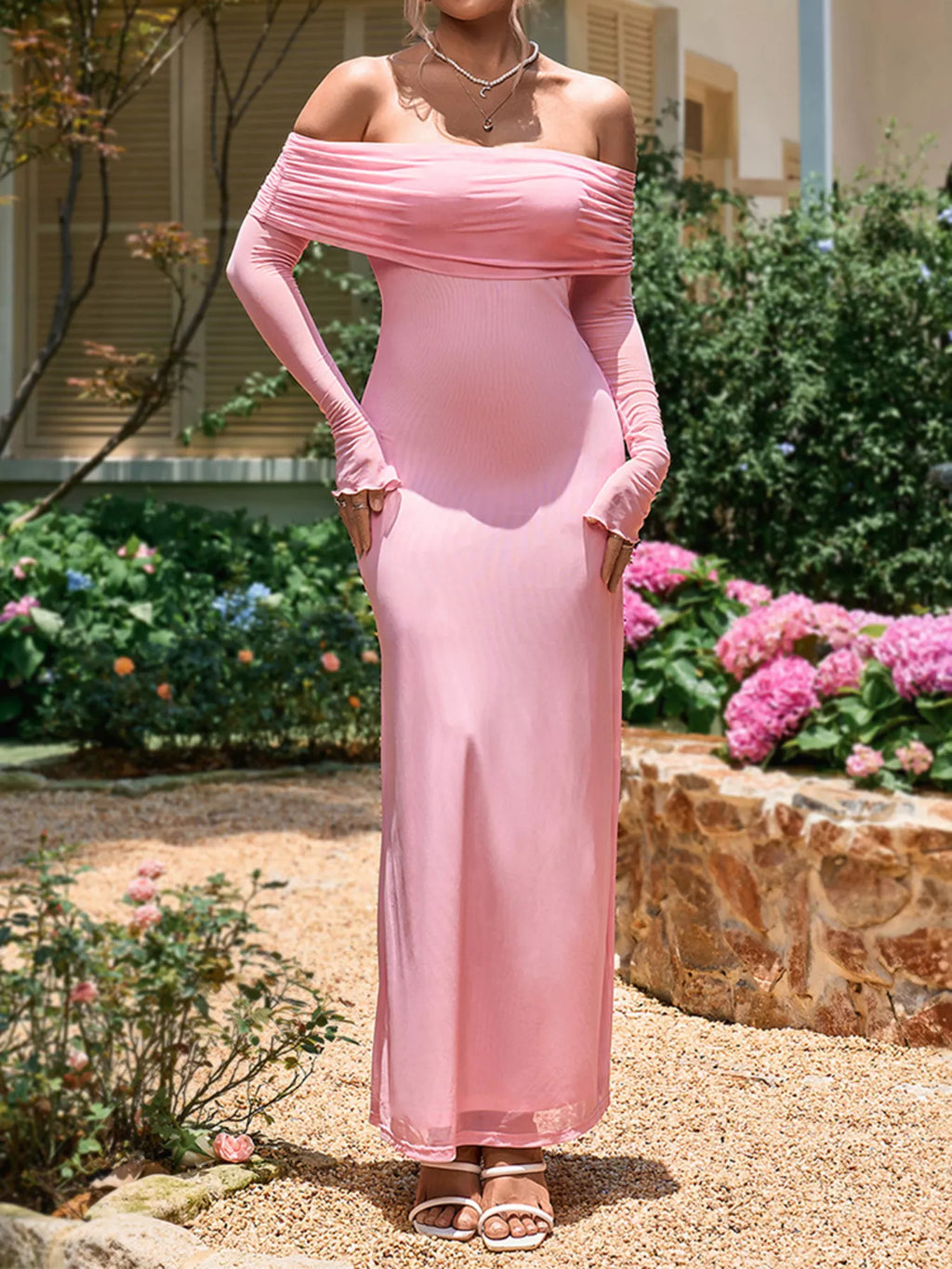 Pink off-shoulder maxi dress with ruched neckline, long fitted sleeves, and ankle-length skirt
