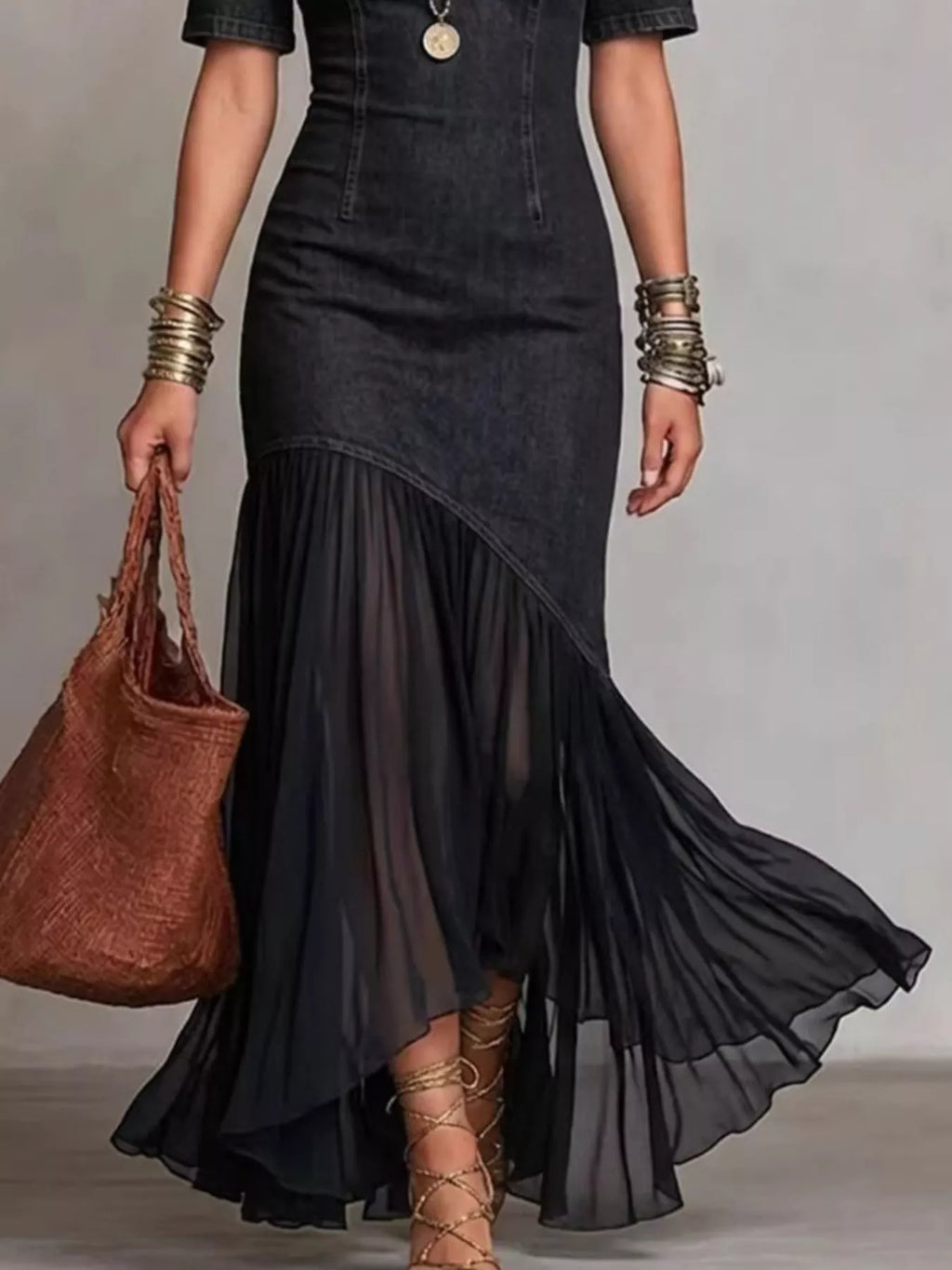 Black cold-shoulder denim maxi dress with layered ruffle skirt and asymmetrical hem