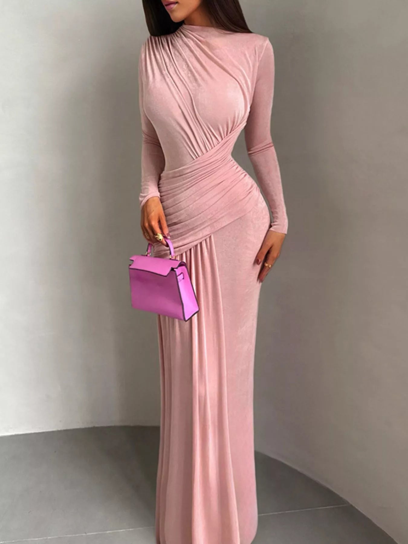Pink ruched long-sleeve maxi dress with high neckline and gathered waist pleats