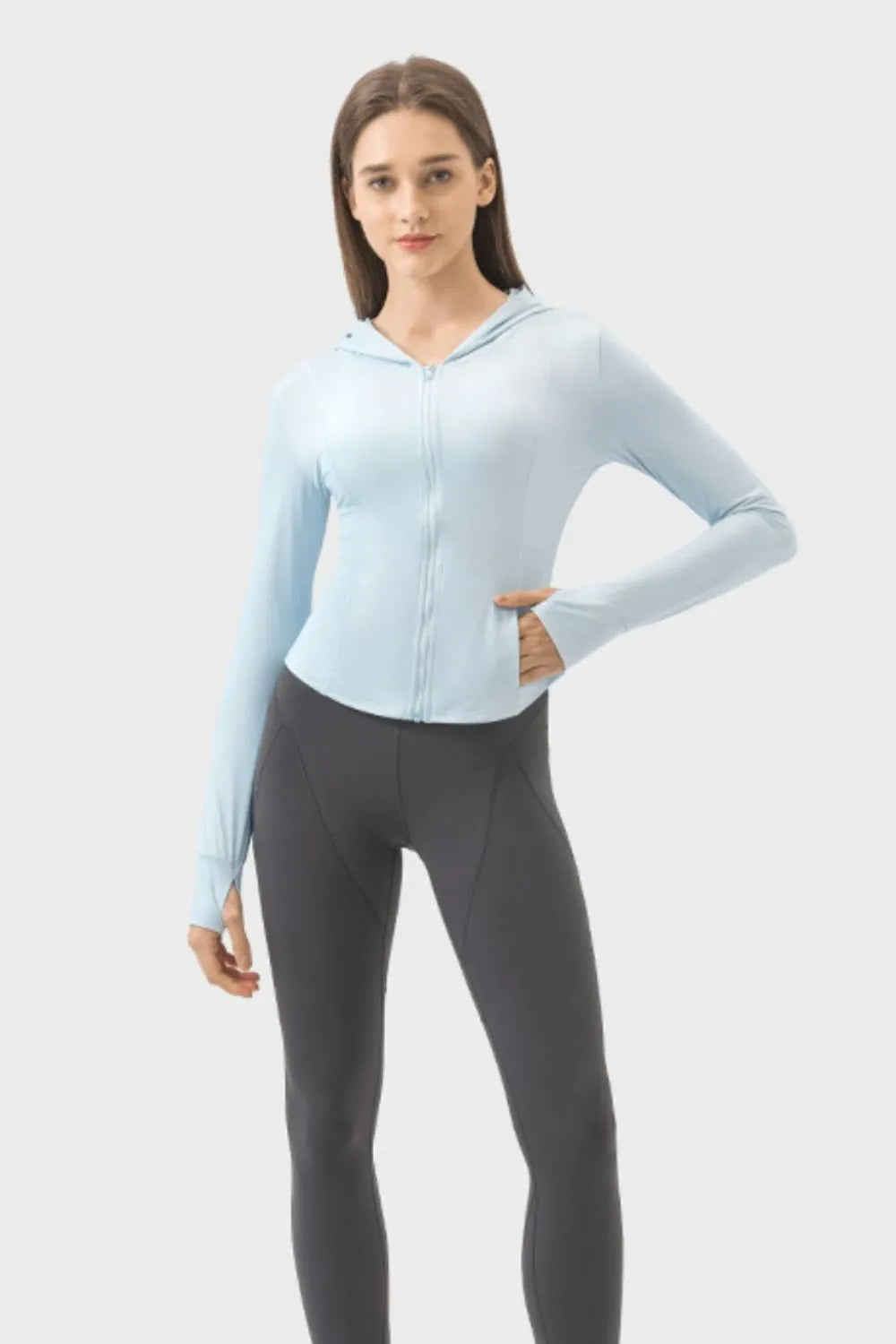 Light blue hooded zip-up long-sleeve active jacket with thumb-sleeve cuffs