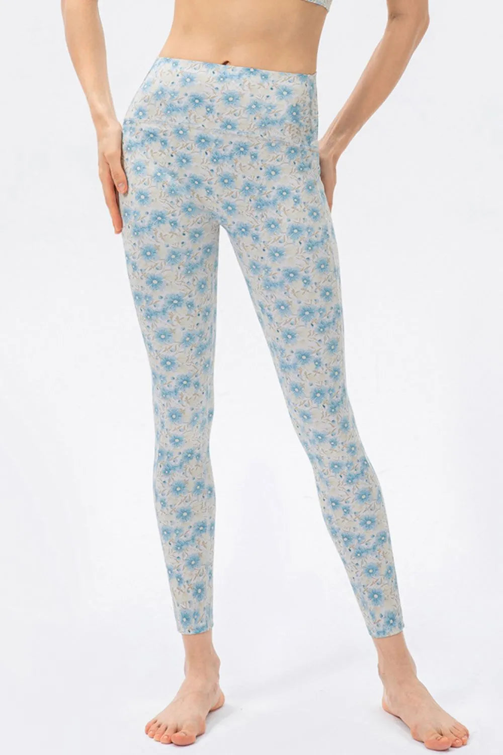 Light blue daisy print high-waist skinny active pants with ankle-length cuffs