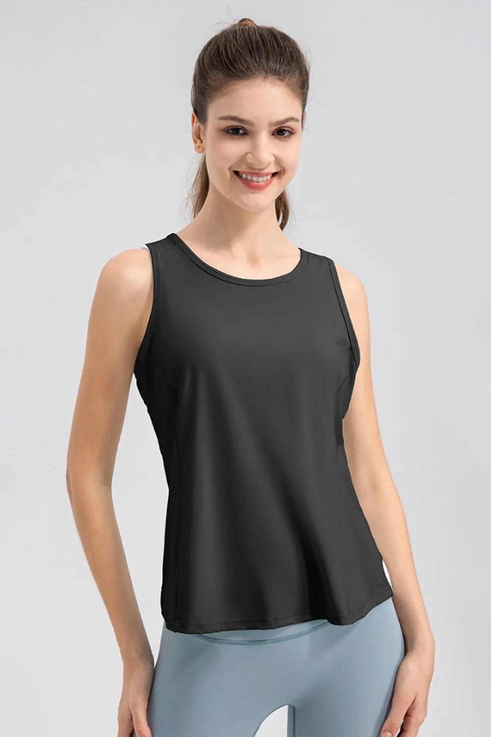 Black active tank top with wide straps and round neck, relaxed athletic fit