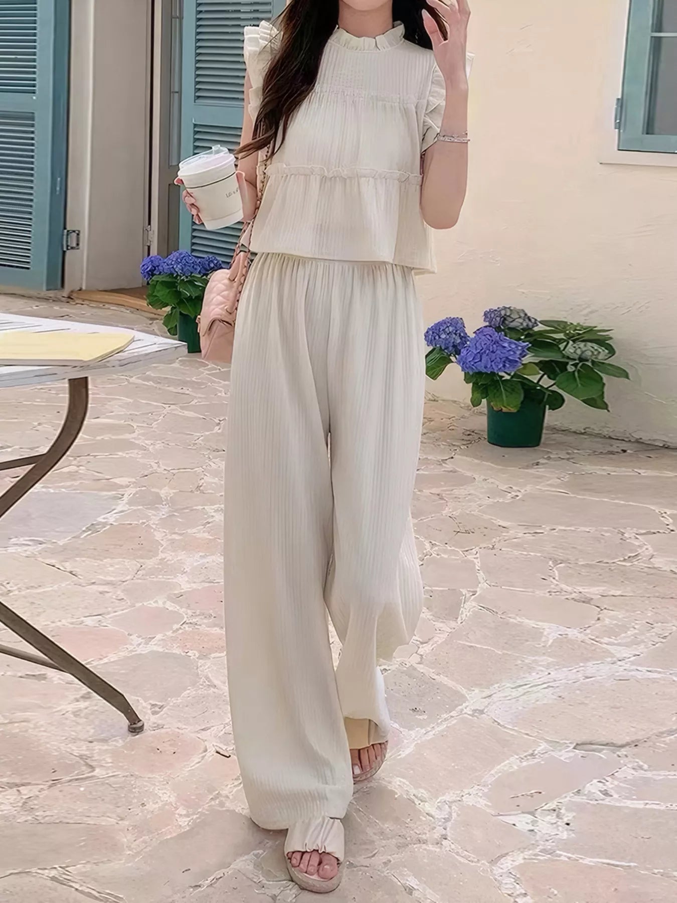 Apricot ruffled sleeveless top and wide-leg pants set with vertical texture
