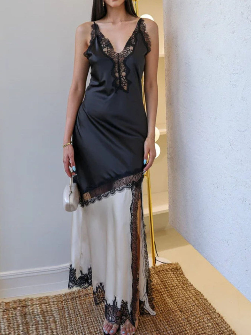 Two-tone lace-trim slip dress with black bodice and cream hem, V-neck lace detail