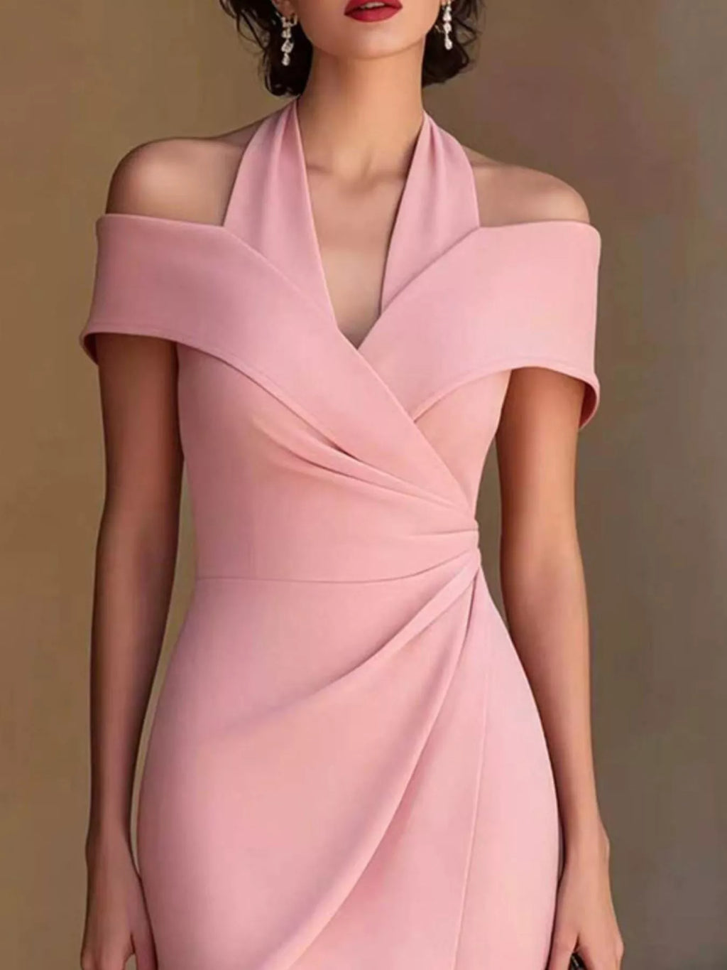 Pink cold-shoulder halter midi dress with deep V wrap detail and smooth fitted drape