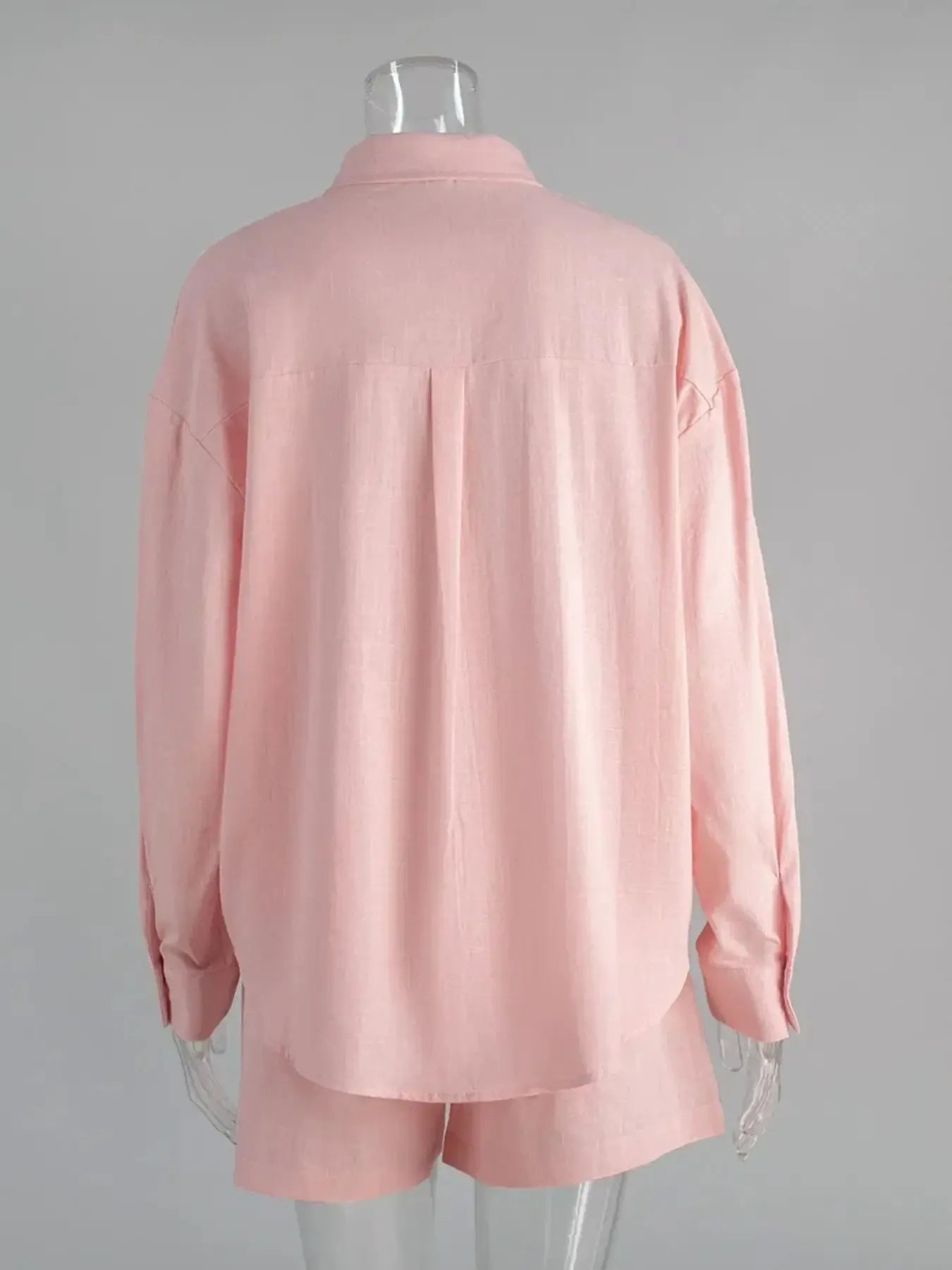 Light pink button-up long-sleeve shirt and matching shorts set, mannequin back