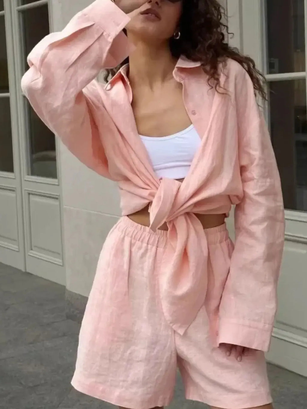 Pink button-up long-sleeve shirt tied at waist with matching high-waist shorts set