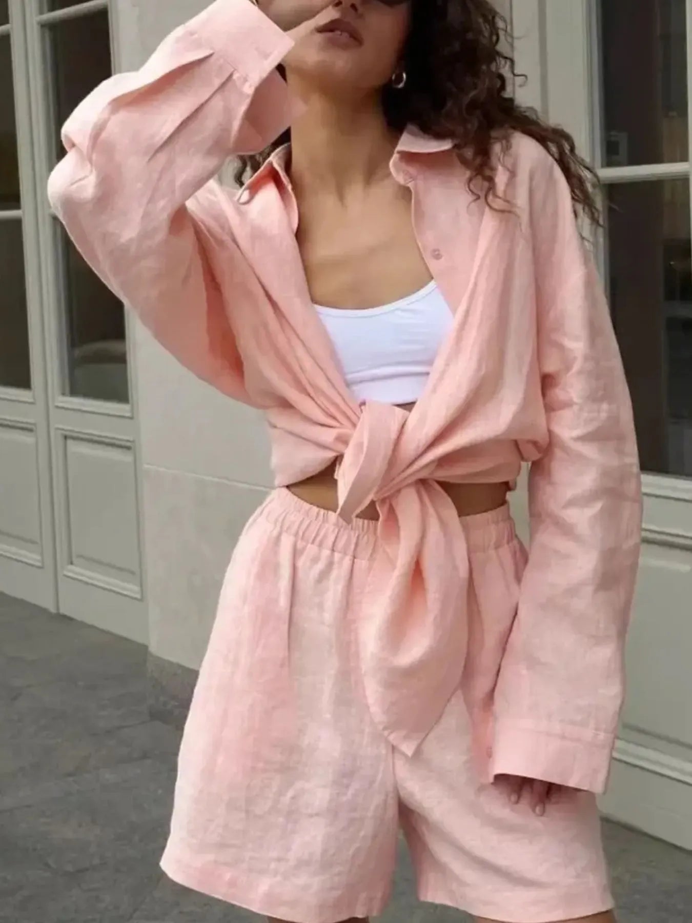 Pink button-up long-sleeve shirt tied at waist with matching high-waist shorts set