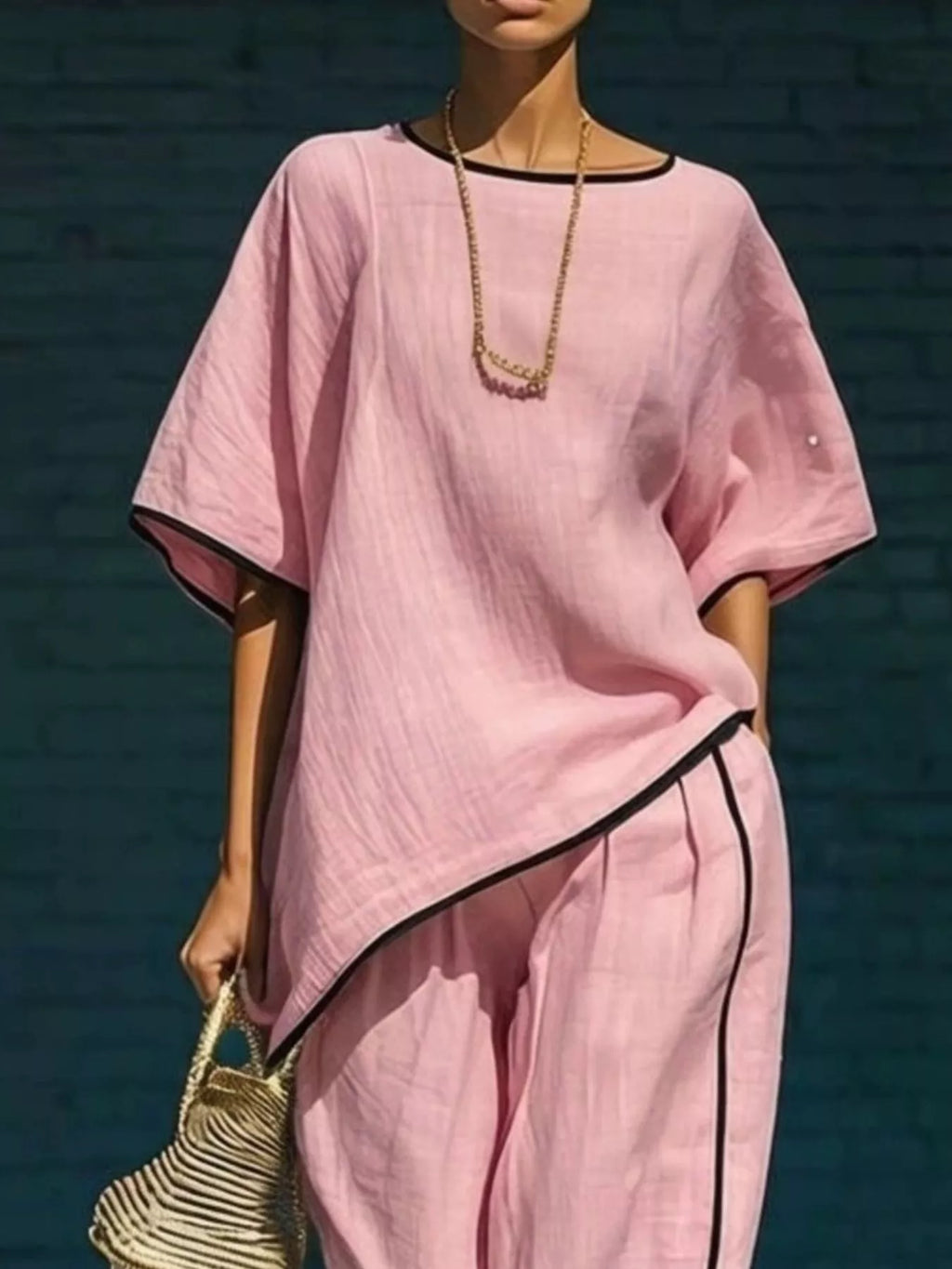 Pink contrast-trim round-neck top and wide-leg pants set with diagonal black piping