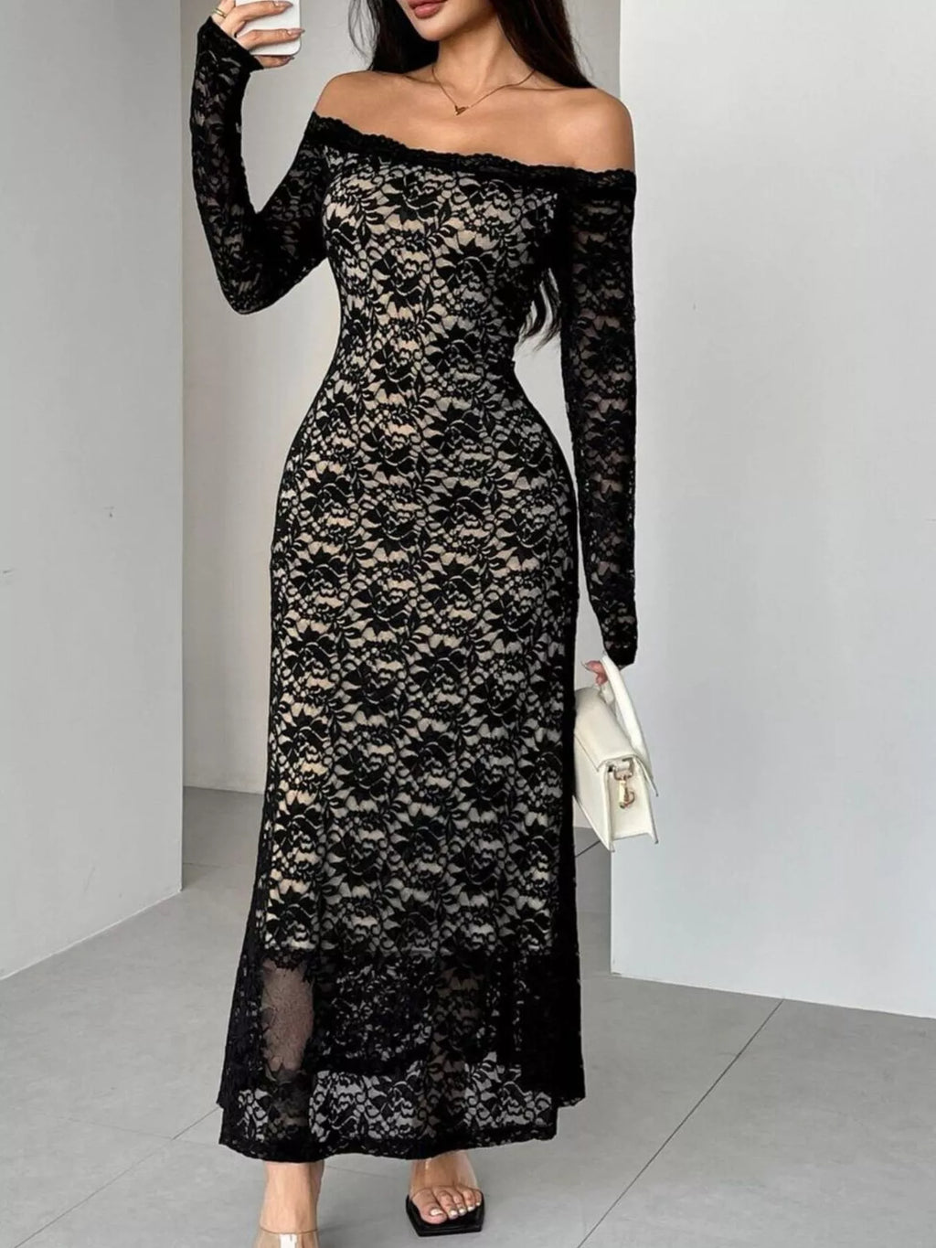 Black off-shoulder lace maxi dress with long sleeves, fitted waist, and full skirt