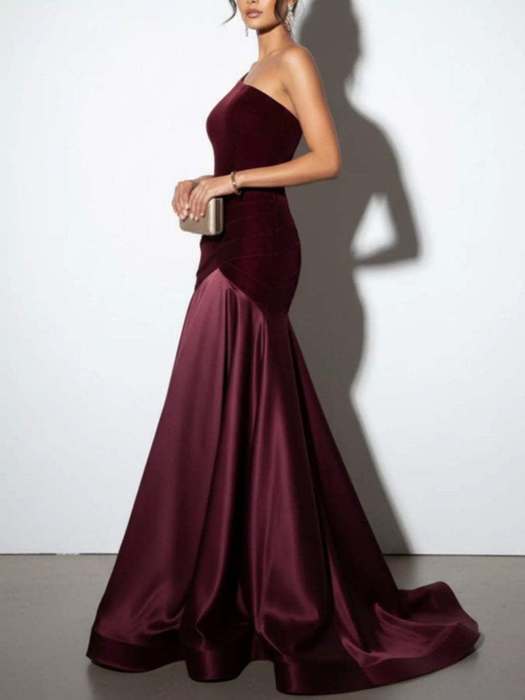 Wine red one-shoulder floor-length dress with draped waist and gathered satin skirt