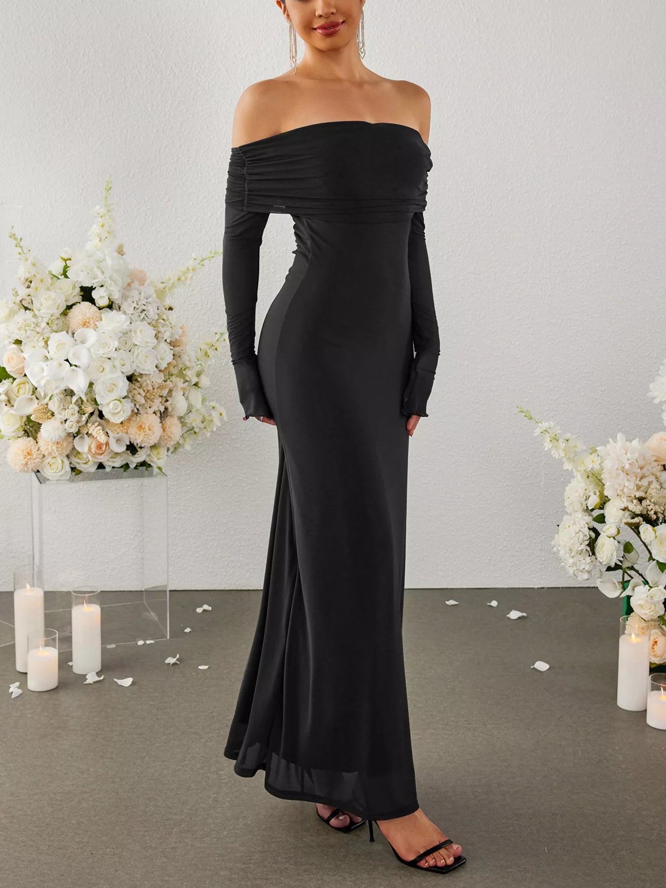 Black off-shoulder ruched maxi dress with long sleeves, side/back view
