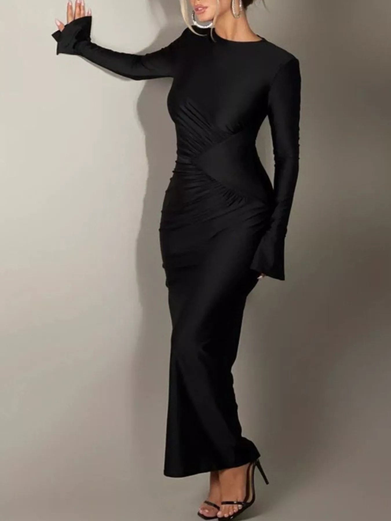 Black ruched bodycon maxi dress with long sleeves and curved side ruching