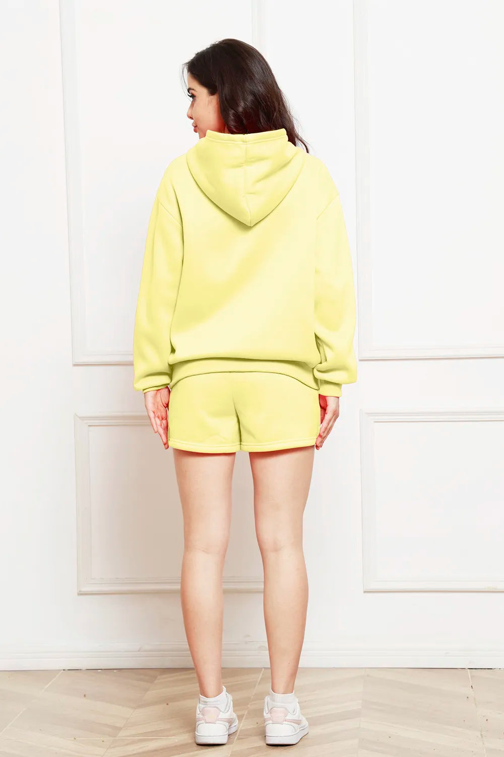 Light yellow hoodie and shorts set, hood up, back view