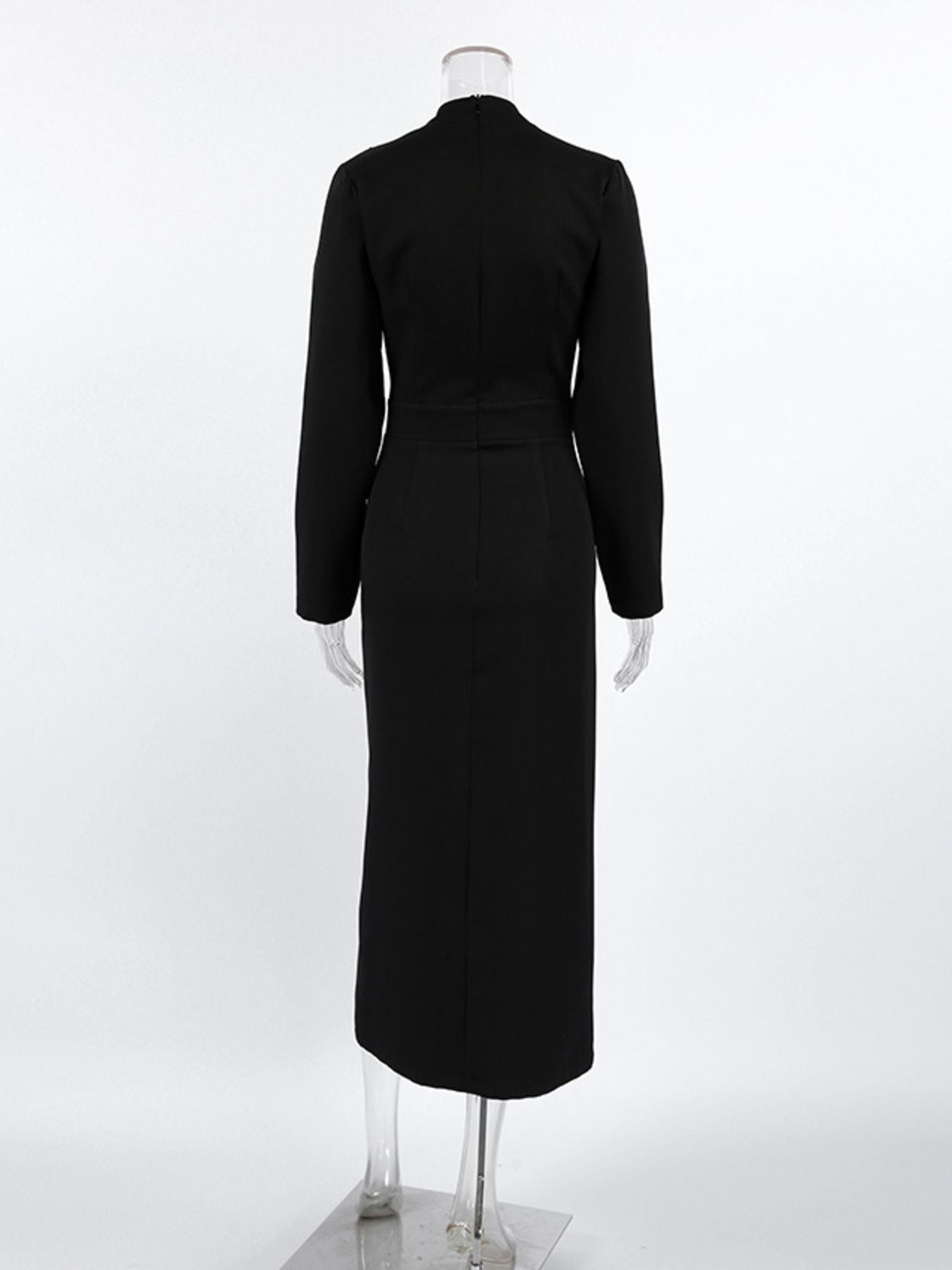 Back view of black long-sleeve midi dress with straight cut and mid-length length.