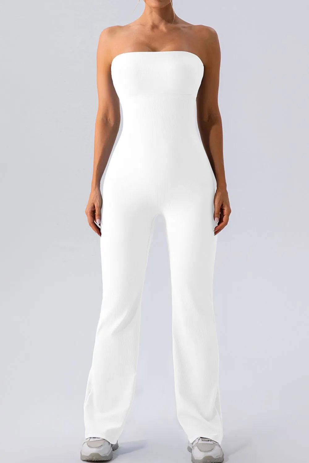White sleeveless straight active jumpsuit, strapless tube bodice, wide-leg straight fit