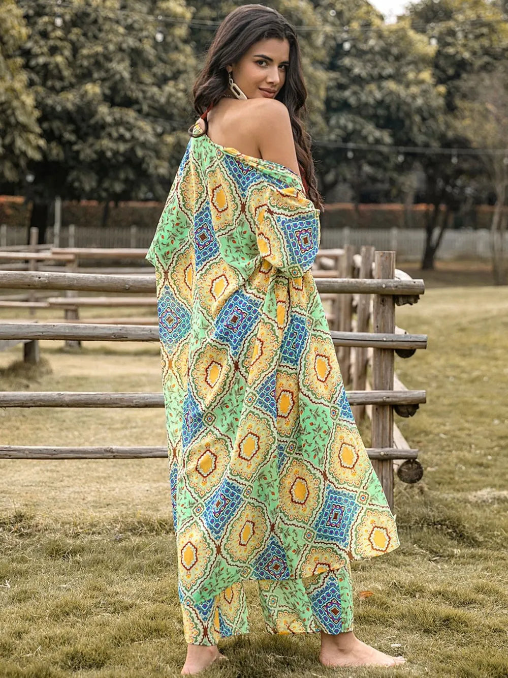 Printed wide-leg pants and half-sleeve top set, back view in multicolor pattern