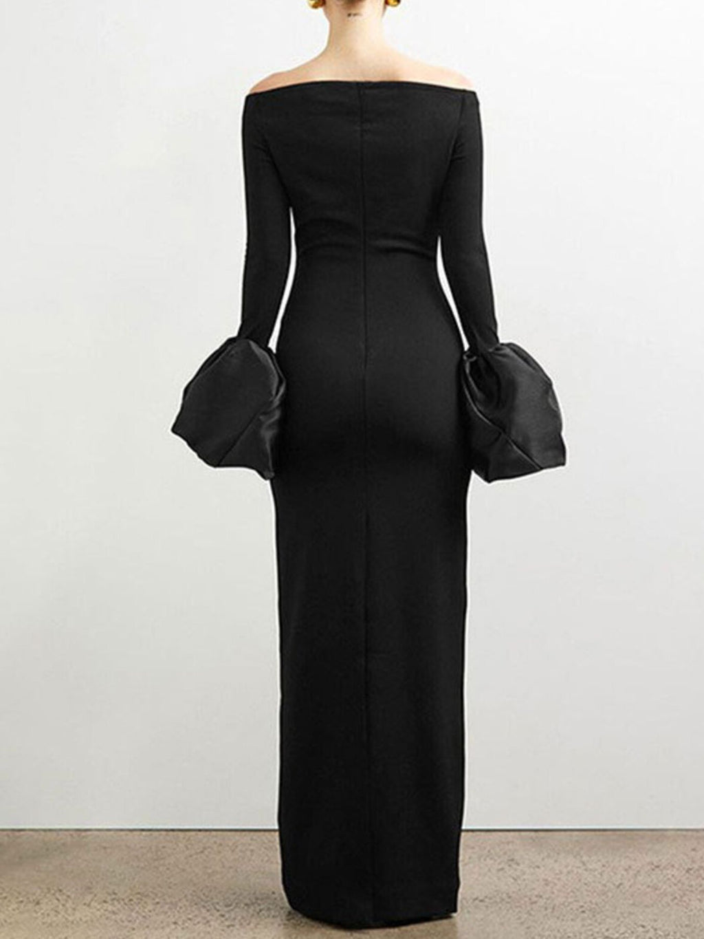 Black off-shoulder maxi dress with long sleeves and gathered flounce cuffs, back view